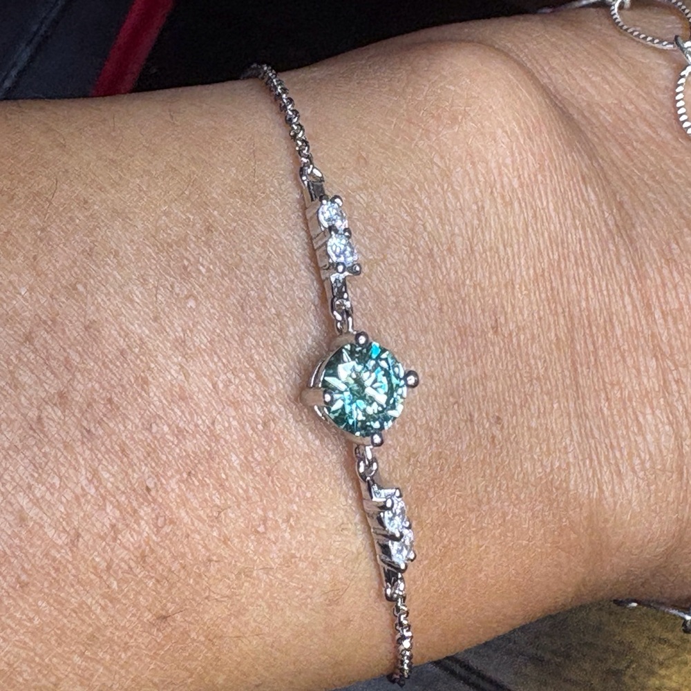 1CT center stone , blue moistanite bracelet sterling silver.